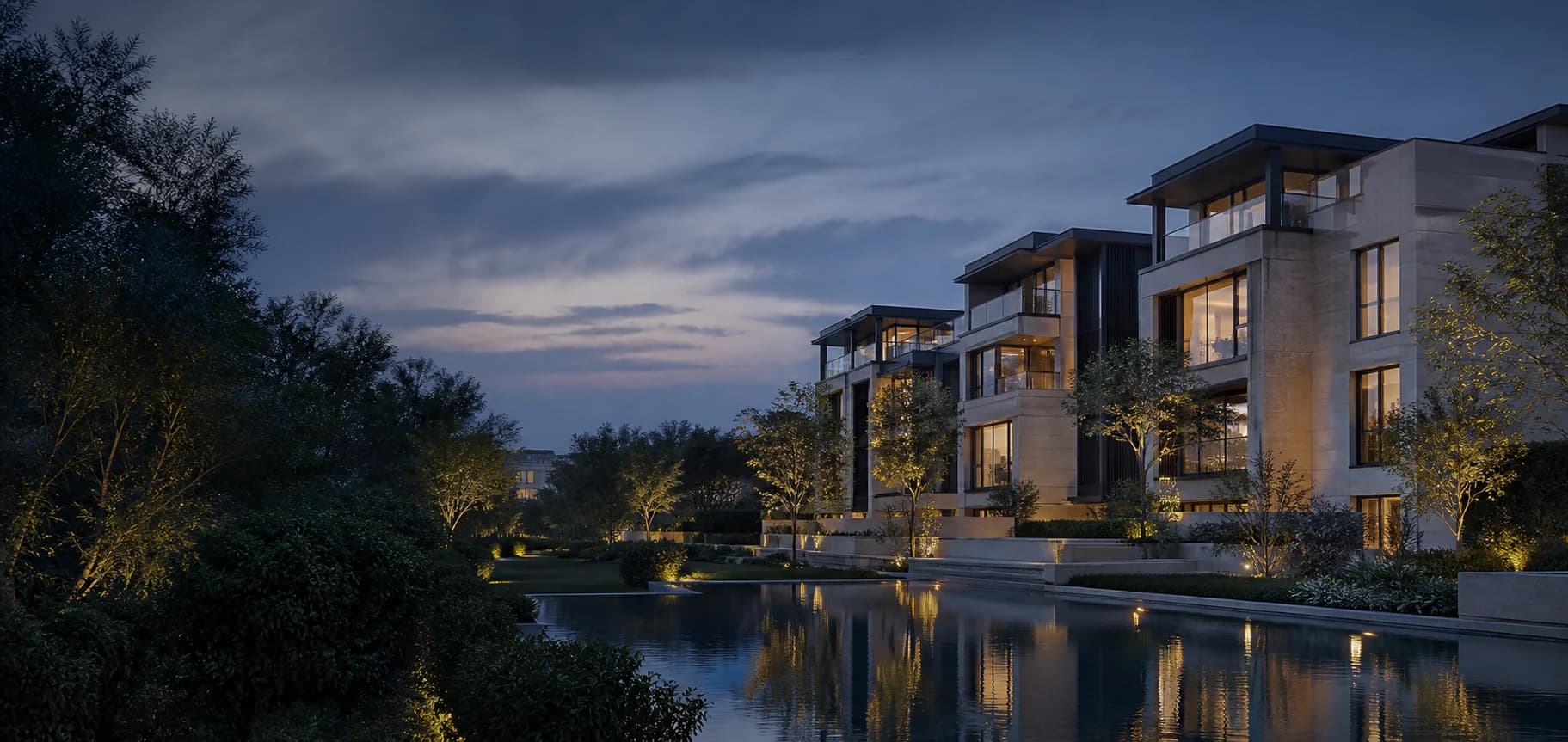 GMark residences set within gardens at dusk